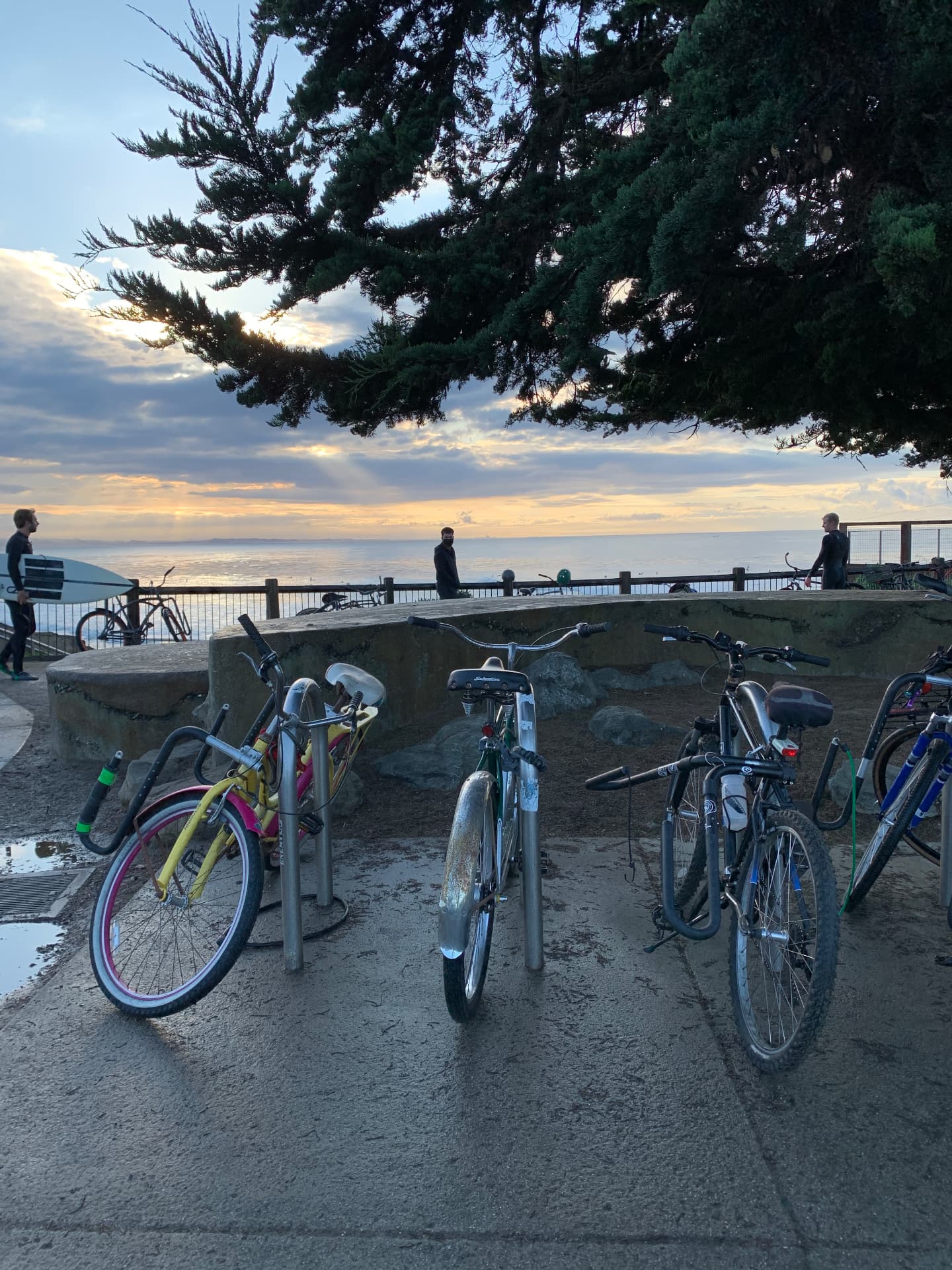 Bikes parked at a Santa Cruz ocean overlook at sunset